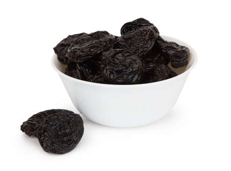 Heap of prunes isolated on white backgroundの写真素材