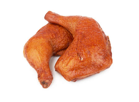 Smoked chicken thighs isolated on a white backgroundの写真素材