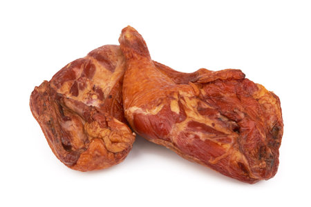 Smoked chicken thighs isolated on a white backgroundの写真素材