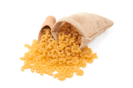 Elbow macaroni isolated on a white backgroundの写真素材