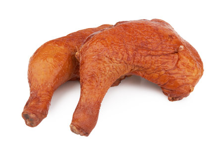 Smoked chicken thighs isolated on a white backgroundの写真素材