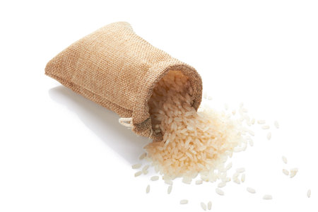 Rice in bag isolated on a white backgroundの写真素材