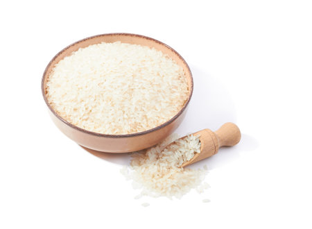 Rice in bowl isolated on white backgroundの写真素材