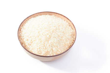 Rice in bowl isolated on white backgroundの写真素材