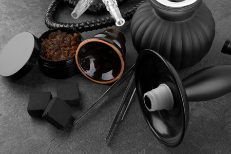 Black hookah on a black stone surfaceの写真素材