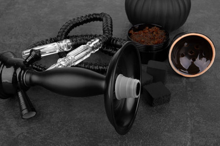Black hookah on a black stone surfaceの写真素材