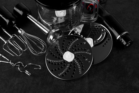 Hand blender isolated on black stone surfaceの写真素材