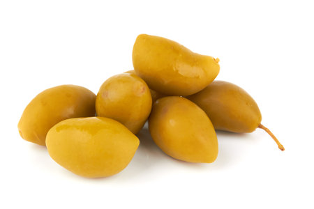 Green olives isolated on a white backgroundの写真素材