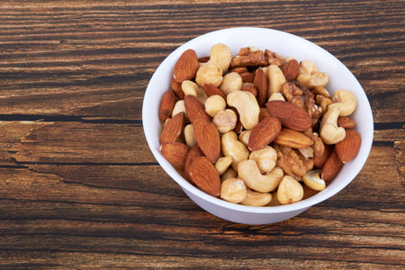 Mix of nuts on wooden backgroundの写真素材