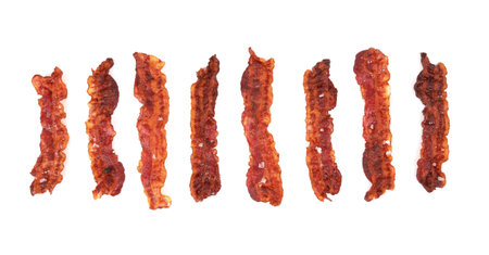 Cooked slices of bacon isolated on whiteの写真素材