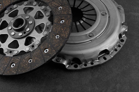 Car engine clutch on black stone surfaceの写真素材