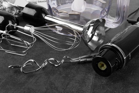 Hand blender isolated on black stone surfaceの写真素材
