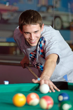 Photo of young man during snooker game.
