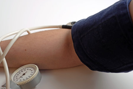 Photo of pressure gauge on hand.