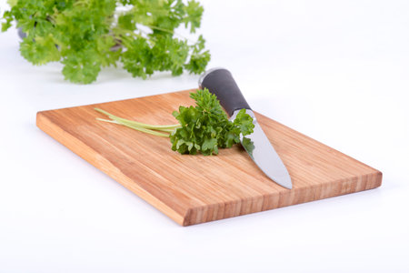 a photo of parsley on a chopping board cookery
