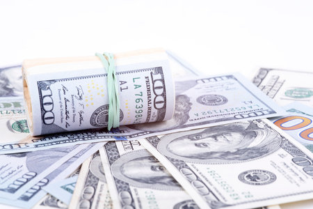 pictures of dollar banknotes on a white backgroundの写真素材