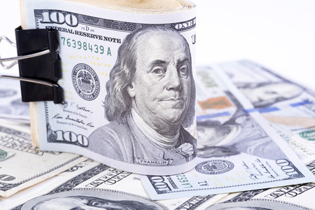 pictures of dollar banknotes on a white backgroundの写真素材