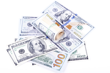 pictures of dollar banknotes on a white backgroundの写真素材