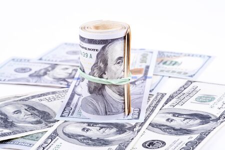 pictures of dollar banknotes on a white backgroundの写真素材