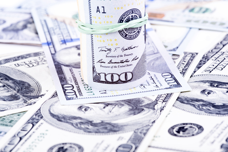 pictures of dollar banknotes on a white backgroundの写真素材
