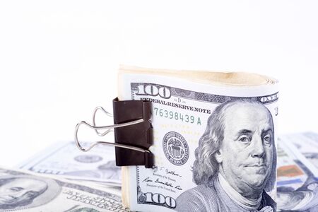pictures of dollar banknotes on a white backgroundの写真素材