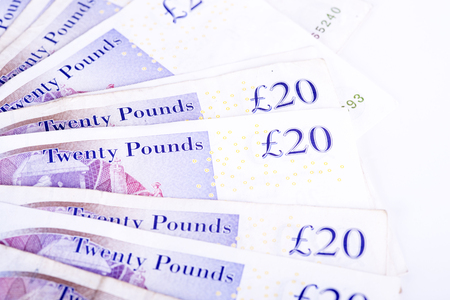 pictures of pounds banknotes on a white backgroundの写真素材