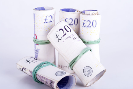 pictures of pounds banknotes on a white backgroundの写真素材