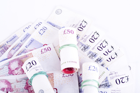 pictures of pounds banknotes on a white backgroundの写真素材