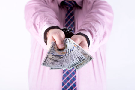 photo showing money with handcuffs