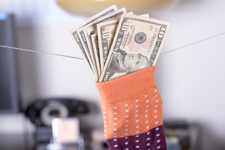 dollar savings hidden in a sockの写真素材