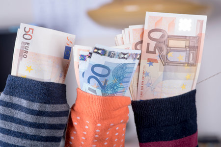 euro savings hidden in a sockの写真素材