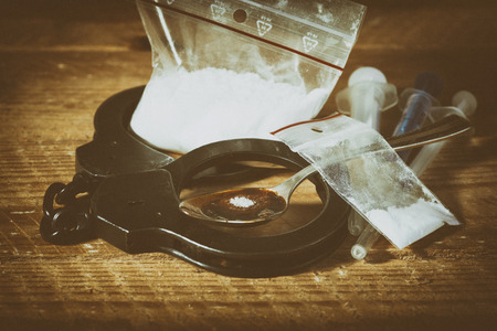 Drug syringe and cooked heroinの写真素材