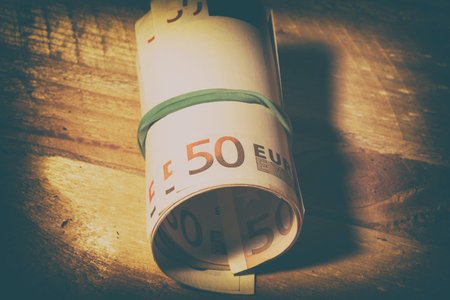 Euro bills tied with rubber bandの写真素材