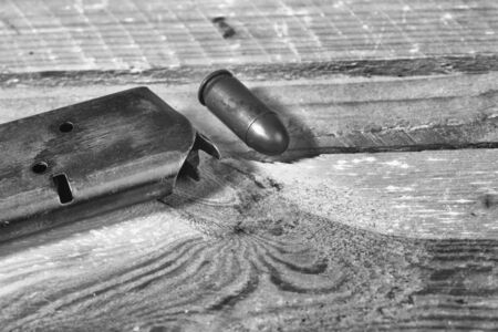 solitary gun  on wooden backgroundの写真素材