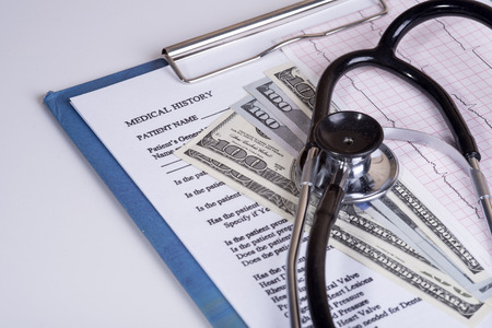 Medical history questionnaire and moneyの写真素材