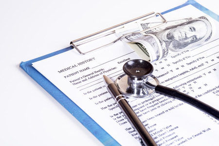 Medical history questionnaire and moneyの写真素材