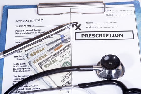 Medical history questionnaire and moneyの写真素材