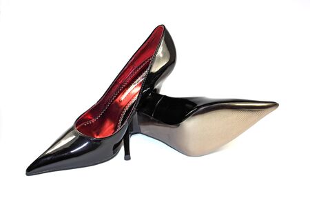 Woman black shoes isolated on the white backgroundの写真素材