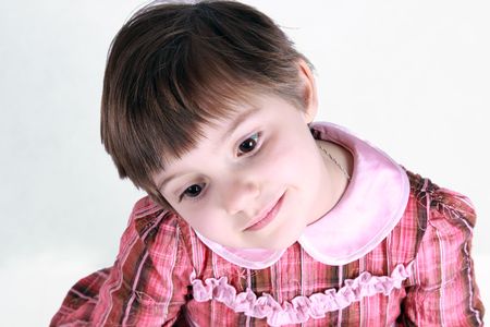 Portrait of little girl in rose dressの写真素材