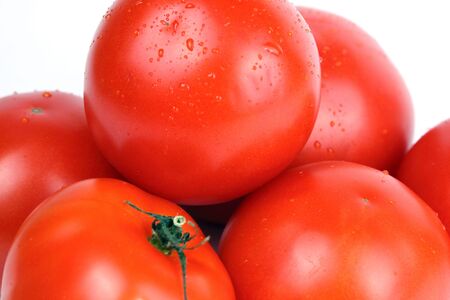 Shot of group fresh tomatoes isolated on white backgroundの写真素材