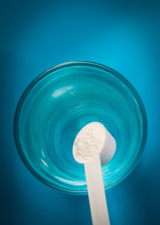 Sports supplement, creatine, hmb, bcaa, amino acid or vitamin mesure with powder. Sport nutrition concept.の写真素材