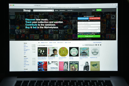 Milan, Italy - August 10, 2017: Discogs website homepage. It is short for discographies, is a website and crowdsourced database of information about audio recordings. Discogs logo visible.のeditorial素材