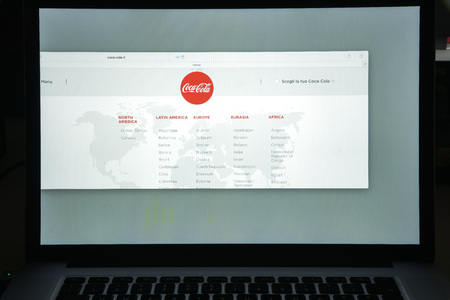 Milan, Italy - August 10, 2017: Coca cola website homepage. It is is a carbonated soft drink produced by The Coca-Cola Company. Cola logo visible.のeditorial素材