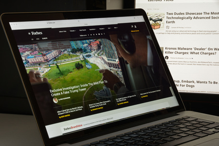 Milan, Italy - August 10, 2017: Forbes website homepage. It is an American business magazine. Forbes.com logo visible.のeditorial素材