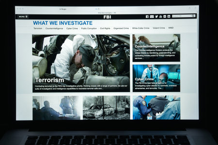 Milan, Italy - August 10, 2017: Fbi website homepage. It is the domestic intelligence and security service of the United States, and its principal federal law agency. FBI logo visible.のeditorial素材