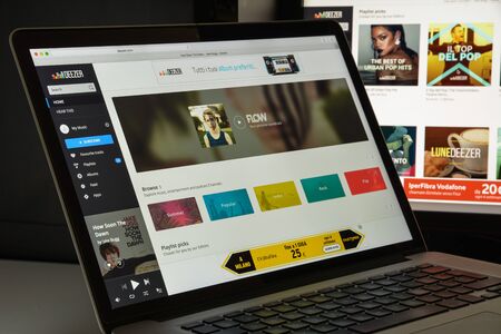 Milan, Italy - August 10, 2017: Deezer website homepage. It is an Internet-based music streaming service. Deezer logo visible.のeditorial素材