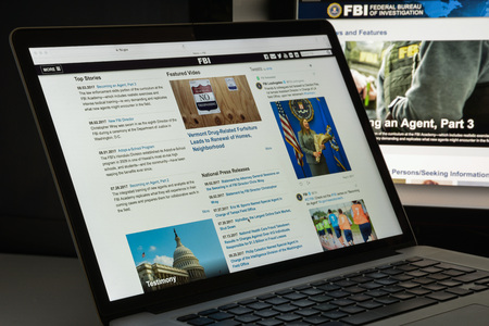 Milan, Italy - August 10, 2017: Fbi website homepage. It is the domestic intelligence and security service of the United States, and its principal federal law agency. FBI logo visible.のeditorial素材
