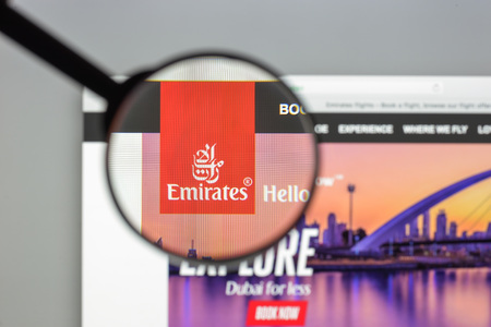 Milan, Italy - August 10, 2017: Emirates flights website homepage. It is an airline based in Dubai, United Arab Emirates. Emirates air lines logo visible.のeditorial素材