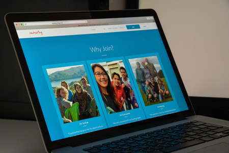 Milan, Italy - August 10, 2017: Couchsurfing website homepage. It is a hospitality service and social networking website. Couch surfing logo visible.のeditorial素材