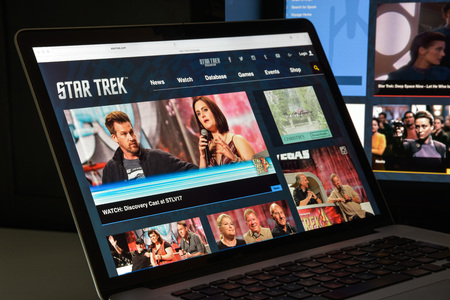Milan, Italy - August 10, 2017: Star trek website homepage. It is an American science fiction media franchise based on the television series. Star trek logo visible.のeditorial素材